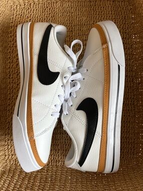 Nike White Sneakers with Black Swoosh and Tan Accent